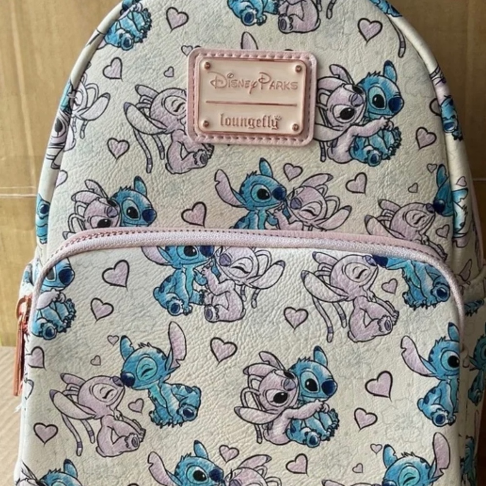 LOUNGEFLY  STITCH and  ANGEL 600 PCS  RETIRED  NWT